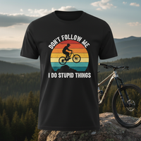 Load image into Gallery viewer, 🌅 Don’t Follow Me, I Do Stupid Things – Retro Mountain Biker Tee 🚵‍♂️😆