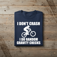 Load image into Gallery viewer, 😂 I Don’t Crash, I Do Random Gravity Checks – Mountain Biking Tee 🚵‍♂️