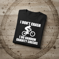 Load image into Gallery viewer, 😂 I Don’t Crash, I Do Random Gravity Checks – Mountain Biking Tee 🚵‍♂️